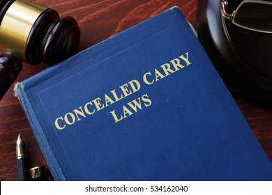 Concealed Carry Laws Title On A Book And Gavel.