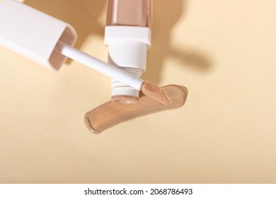 Concealer Cream On A Background With Shadows. Face Corrector On Beige Background With Copy Space. Blank Mockup For Product