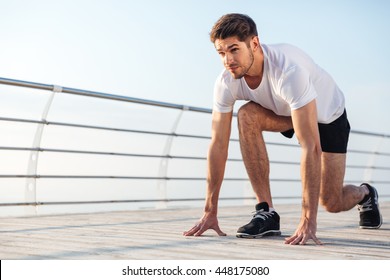 Concentrared Young Sportsman Is Ready To Run Outdoors In The Morning