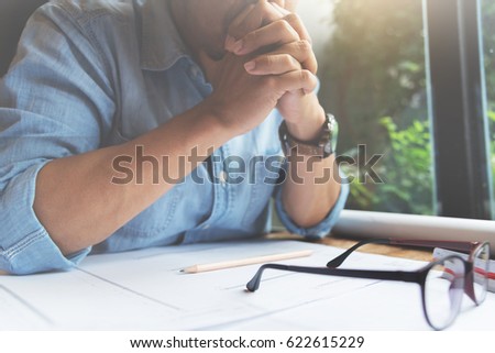 Similar – Image, Stock Photo Frustration in garden office | man sits at table in front of laptop and holds hands in front of face