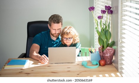 Concentrated Father And Son In Glasses Use Computer. Family Blog. Nerd Boy Do Homework