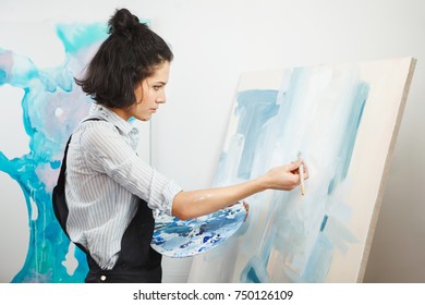 Concentrated Girl Focused On Creative Art-making Process In Art Therapy