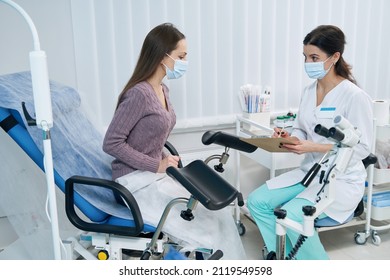 Concentrated gynecologist listening to her patient complaints - Shutterstock ID 2119549598