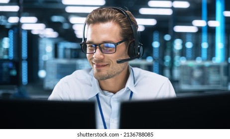 Concentrated Male Customer Support Agent Receptionist wear Headset Consult Online Client Looking at Computer Screen, Helpline Operator Secretary Make Conference Video Call