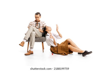 Concentrated Man Counting Expenses And Woman Painting Nails Isolated On White Background. Retro Style. Concept Of Business, Shopping, Activity, Black Friday, Success, Career, Expression, Ad