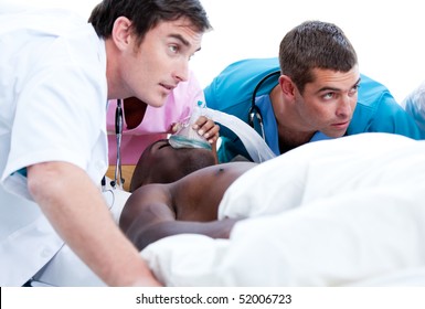 Concentrated medical team resuscitating a patient in a hospital