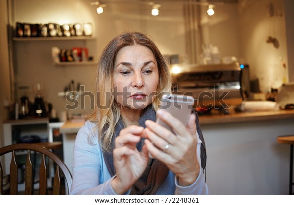 Concentrated Middle Aged Woman Blonde Hair Stock Photo Edit Now