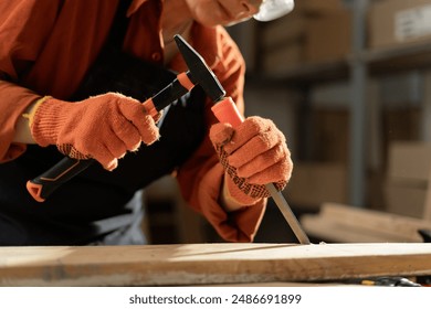 concentrated professional female carpenter builder using equipment on wooden plank working in workshop. Carpenter hobby concept. Close-up - Powered by Shutterstock