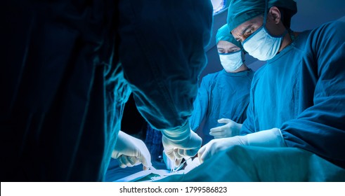 concentrated professional surgical doctor team operating surgery a patient in the operating room at the hospital. healthcare and medical concept.