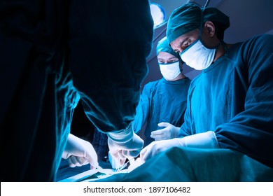 concentrated professional surgical doctor team operating surgery a patient in the operating room at the hospital. healthcare and medical concept.
 - Powered by Shutterstock