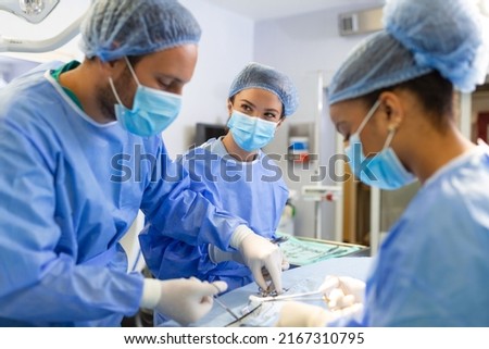 concentrated professional surgical doctor team operating surgery a patient in the operating room at the hospital. healthcare and medical concept.