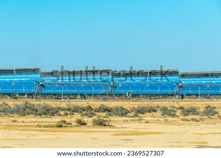 Concentrated Solar Power CSP. Parabolic trough solar mirrors generate renewable energy in the Negev Desert in southern Israel.
