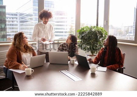 Concentrated team work, young people, doing a metting