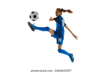 Concentrated teen girl, soccer player in blue uniform kicking ball in motion in jump isolated on white studio background. Concept of sport, active and healthy lifestyle, childhood, school, hobby - Powered by Shutterstock