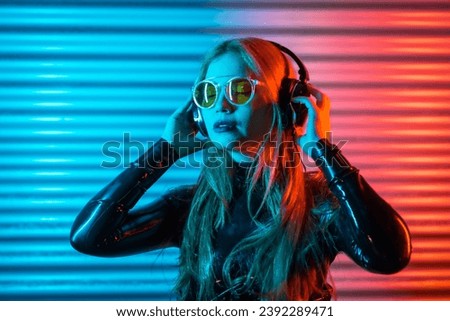 Similar – Young woman dancing and listening to music