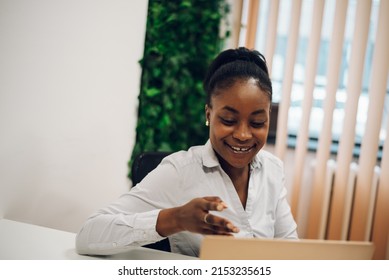 Concentrated Young Black Business Woman Working On A Laptop While Sitting At The Table In The Office. Confident Business Expert. E-commerce, Internet Technology Or Small Business Concept.