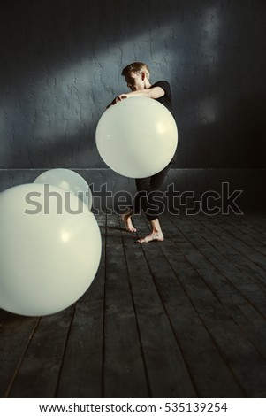 Young teenage girl blowing pink bubble gum