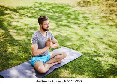 Young Man Meditating Outdoors Park Sitting Stock Photo 1048448299 ...