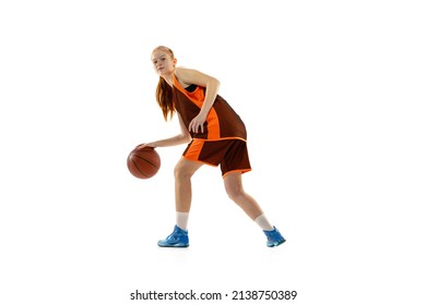 Concentration. Portrait Of Young Girl, Teen, Basketball Player Training, Dribbling Ball Before Throwing Isolated Over White Studio Background. Concept Of Professional Sport, Health, Active Lifestyle