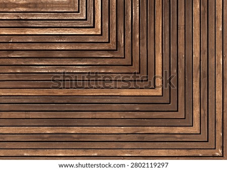Concentric right angle corner pattern crafted from linear natural brown wood cladding planks, modern symmetrical timber panel texture backdrop