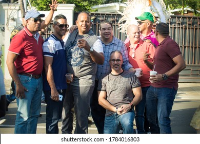 Concepcion De La Vega, DOMINICAN REPUBLIC - FEBRUARY 18, 2019: group of adult native men poses for photo on city street at dominican carnival on February 18 in Concepcion De La Vega