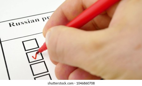 Concept Of The 2018 Russian Presidential Election On 18 March 2018. Hand Voting In A Ballot By Red Pencil