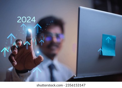 Concept 2024, modern online technology businessman displays charts, stock market charts and rising arrows for investments, analyzes profits and high dividends in the year of enterprise. finance