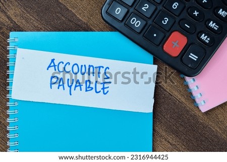 Concept of Accounts Payable write on sticky notes isolated on Wooden Table.