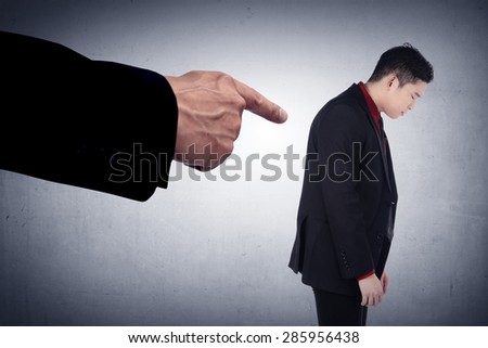 Concept of accused businessman with with fingers pointing. Human face expression emotion feeling