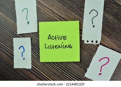 Concept Of Active Listening Write On Sticky Notes Isolated On Wooden Table.