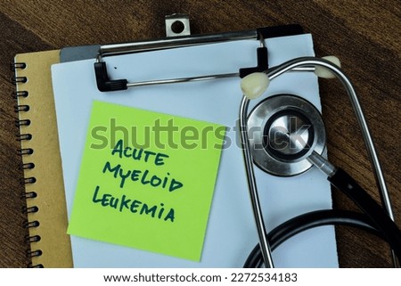 Concept of Acute Myeloid Leukemia write on sticky notes with stethoscope isolated on Wooden Table. ストックフォト © 