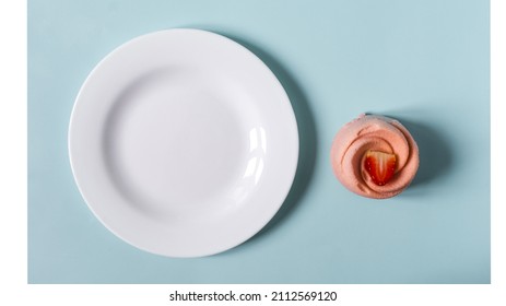 The Concept Is An Airy Strawberry Shortcake With A Sponge Cake And A White Plate On A Blue And White Background.