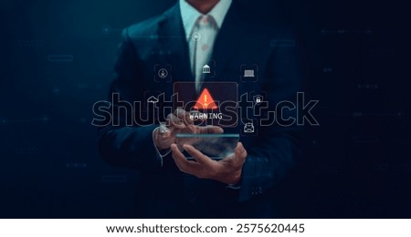 Concept alert or warning, Technology scam, businessman showing warning of access to malicious cyber attack virus software or online network hacking threat. Technology security with smartphone.