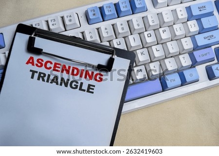 Concept of Ascending triangle write on clipboard isolated on Wooden Table.