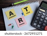 Concept of ATR - Average True Range write on sticky notes isolated on Wooden Table.