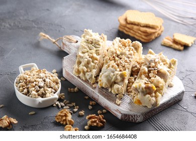 The Concept Of Australian Cuisine. Rocky Road. Sweet Cookies With Nuts, Air Rice And White Chocolate On A Grey Background. Background Image, Copy Space