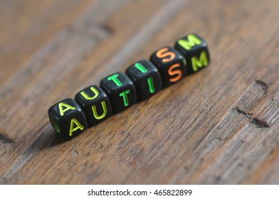 concept of autism word on wooden table - Shutterstock ID 465822899