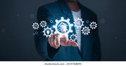 concept of automatic control system with modern technology Innovation for business process management.businessman touches a gear icon showing the operation of robotic automation software.