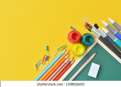 The Concept Of Back To School, Top View Of Student Table In Watercolor Classroom Background With Copy Space For Text
