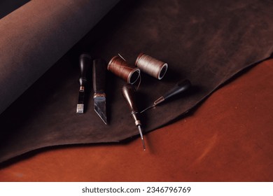 Concept background tailor shoes maker from skin. Natural leather brown color with tools, top view. - Powered by Shutterstock