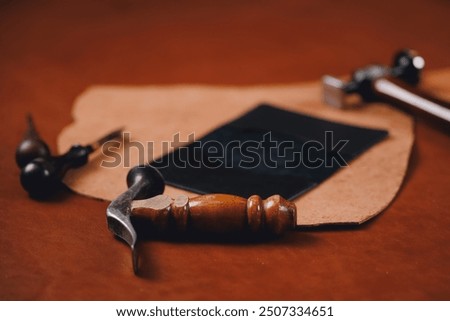 Concept background tailor shoes maker from skin. Natural leather brown color with tools, top view.