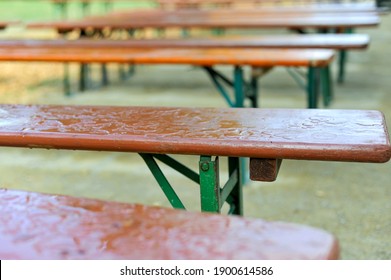 Concept Bad Times While Lockdown In The Gastronomy: Empty Benches In A Beer Garden Of A Restaurant In The Rain – Selective Focus