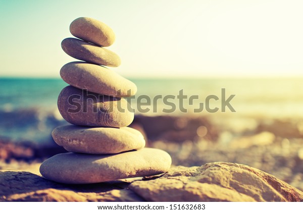 concept of balance and harmony. rocks on the coast\
of the Sea in the\
nature