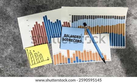 Concept of Balanced Scorecard write on sticky notes isolated on Wooden Table.