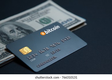 Concept bank card bitcoin on a dark background