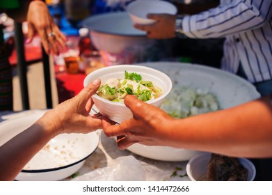 the concept of begging and hunger : Hunger problems of the poor have been donated food to reduce hunger : the concept of food shortage in the world : Donate Food with Love and Hope to the Poor - Shutterstock ID 1414472666