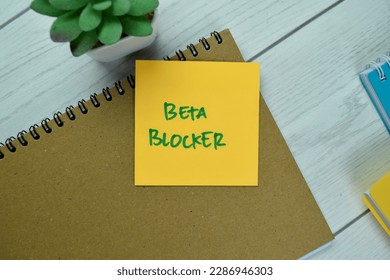 Concept of Beta Blocker write on sticky notes isolated on Wooden Table.
