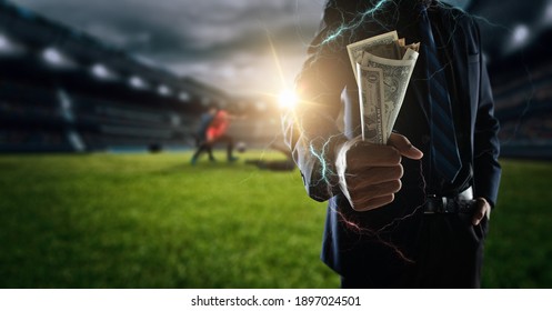 Concept Of Betting Bet Sport.businessman Holding Large Amount Of Bills At Soccer Stadium In Background.