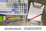 Concept of Bilateral Contract write on paperwork isolated on Wooden Table.