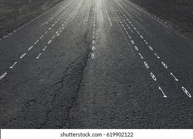 Concept binary code numbers travel information on black textured sunny asphalt road. Conceptual information superhighway or infobahn telecommunications network background.